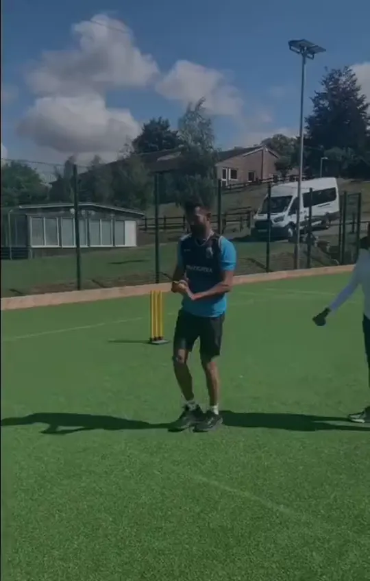 A bowler training on the outfield